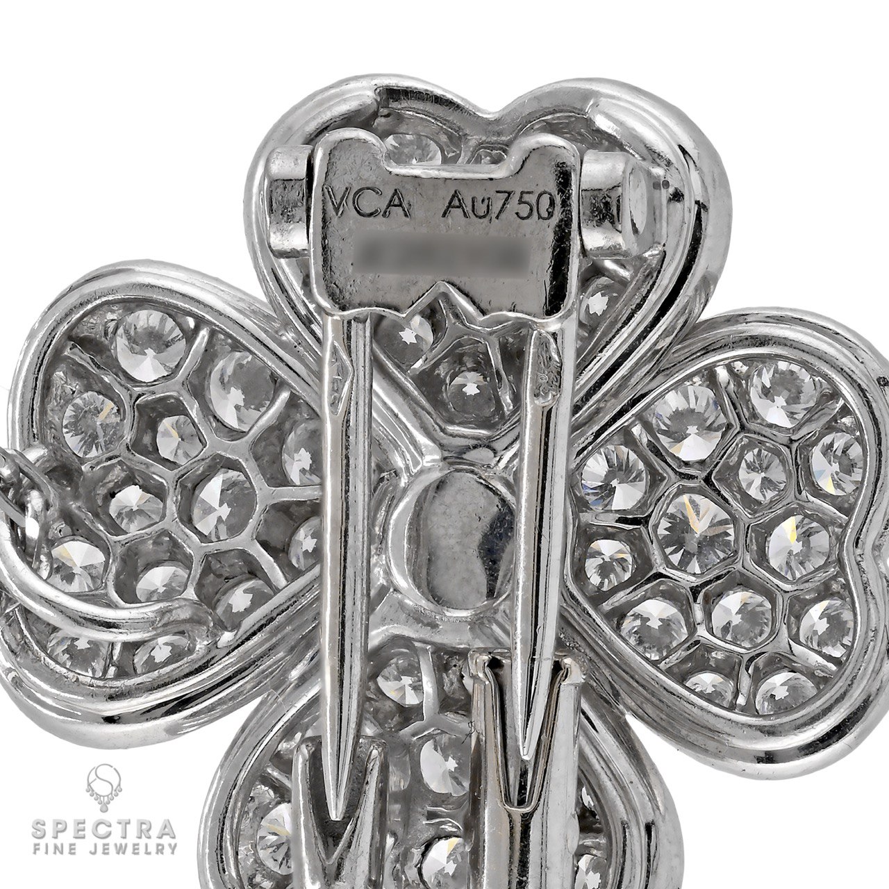 VCA Cosmos pendant showing VCA Au750 hallmark and serial on the back